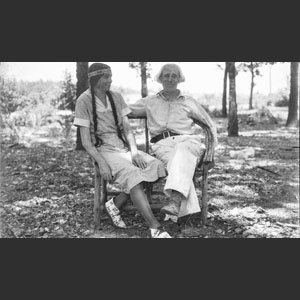 Chief and princess on bench at their house