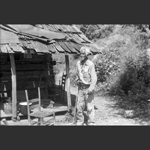 Jacob Young-Deer My Cherokee Uncle in front of cabin