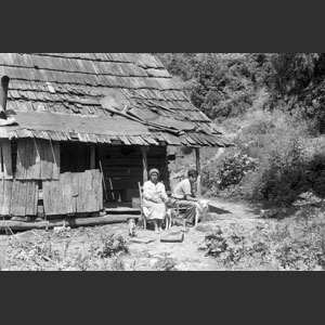 My Cherokee Aunt in front of cabin Cherokee Reservation