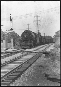 Rail-road engine starting across trestle - Shelby Park