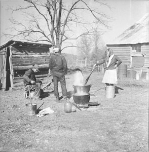 Ruth and Claudis cooking lard - Vernon in photo - Thanksgiving day